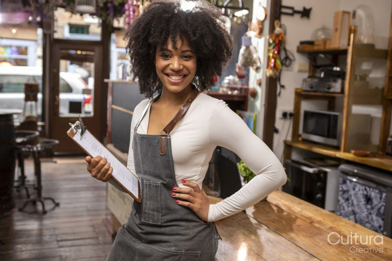 Portrait of smiling cafe owner