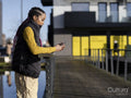 Young woman using phone in urban setting