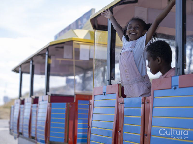 Siblings on land train tourist ride