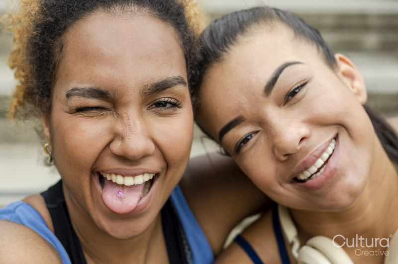 Portrait of female friends making faces