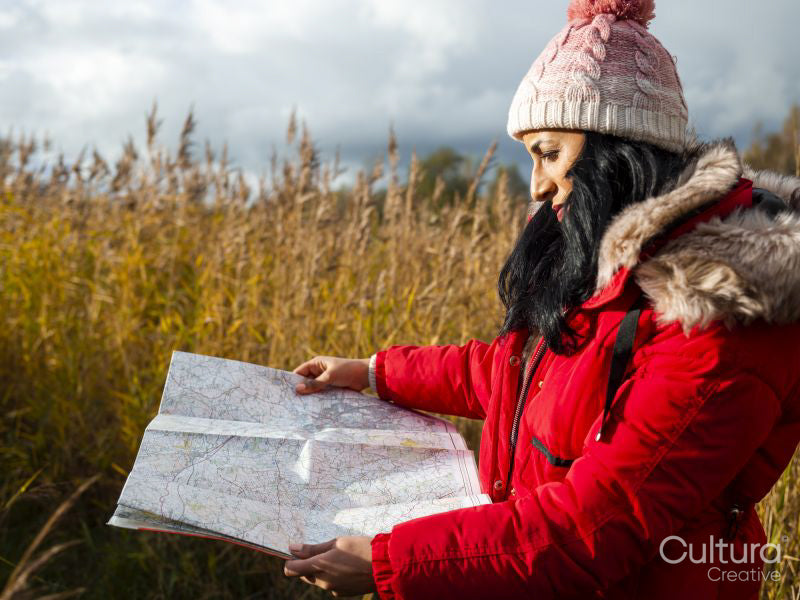 Female hiker using map