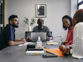 Colleagues talking at business meeting
