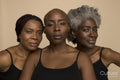 Studio portrait of three confident women in black tops