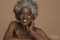 Studio portrait of smiling senior woman