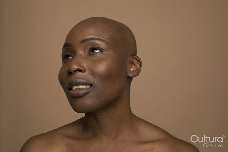 Studio portrait of smiling woman