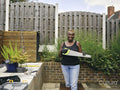 Portrait of woman holding saw on patio