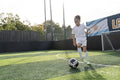 Girl playing soccer on soccer field