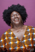 Studio shot of laughing woman with big hair