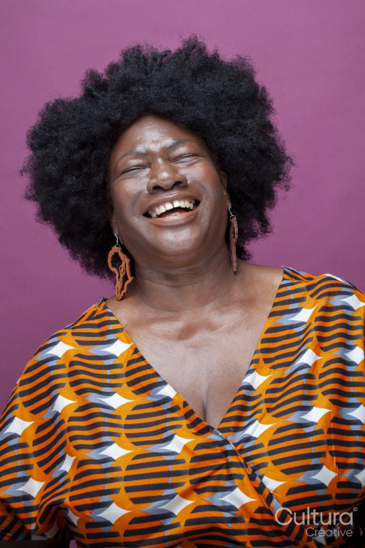 Studio shot of laughing woman with big hair