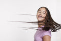 Studio portrait of smiling girl with long braided hair