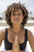 Woman meditating outdoors