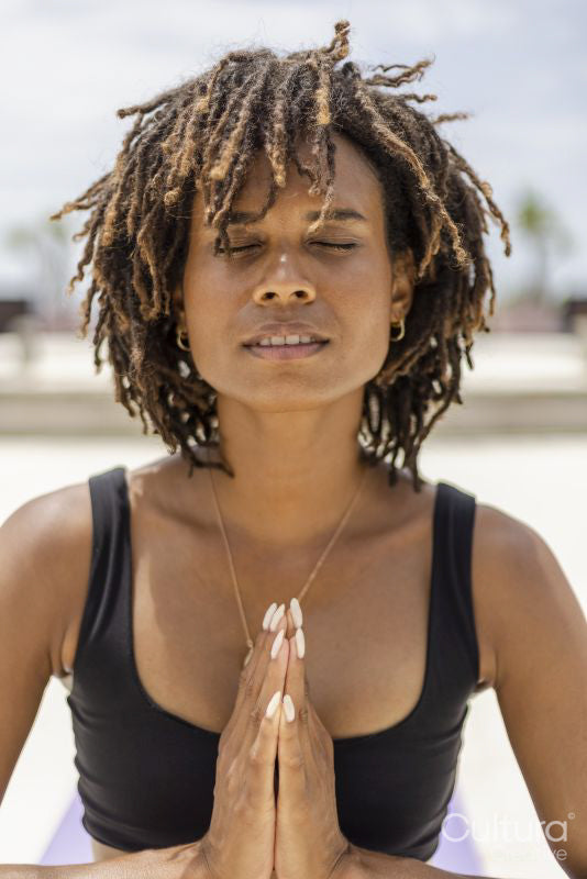 Woman meditating outdoors
