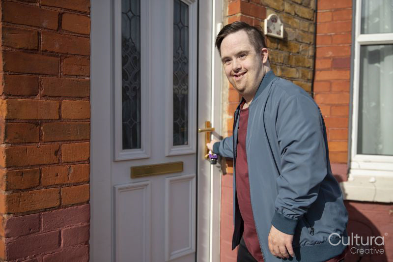 Man locking door of his house