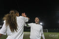 Female soccer players celebrating