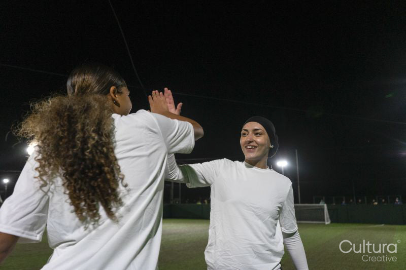 Female soccer players celebrating