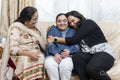 Family portrait with a young woman with down syndrome smiling at home