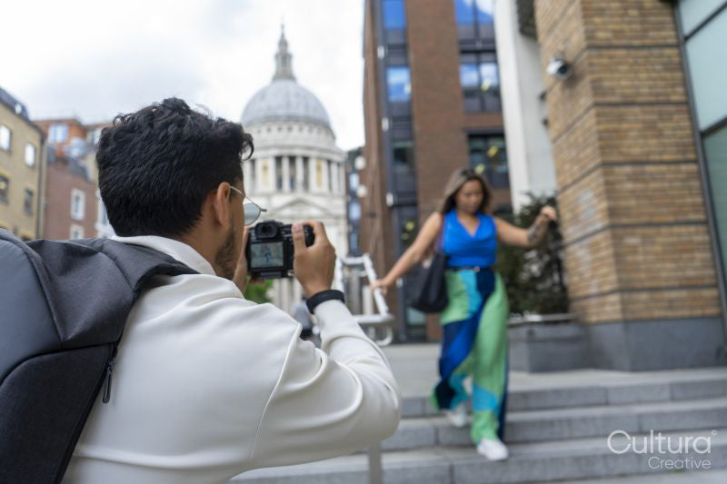 United Kingdom, London, Man taking pictures of woman in street