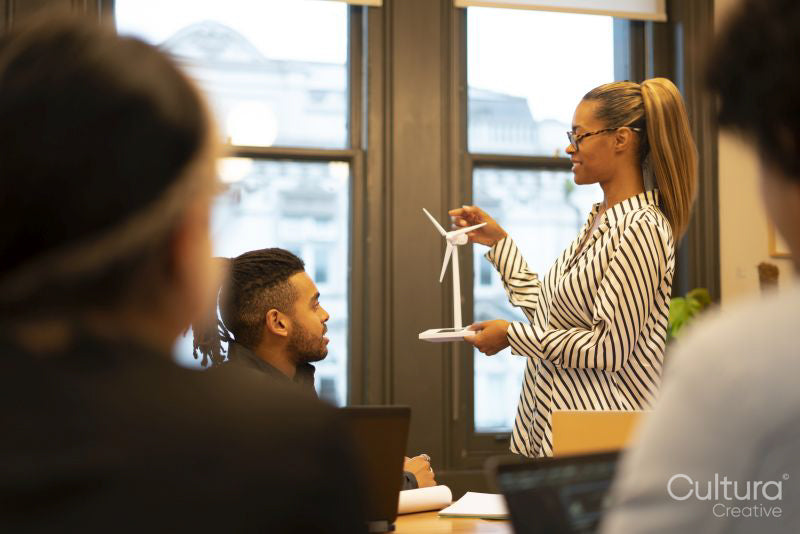 Business people discussing wind turbine model