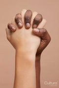 Studio shot of two women holding hands