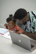 Father and daughter drawing together in notepad