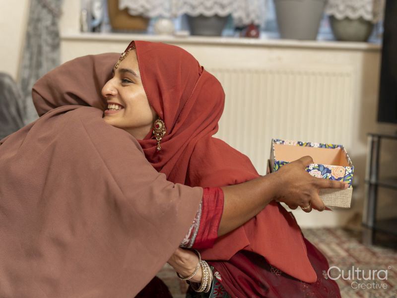 Smiling woman hugging during Ramadan celebration at home