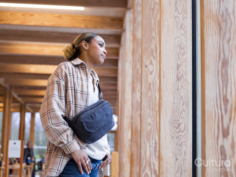 Young woman waiting in hallway