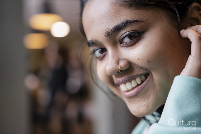 Close-up portrait of smiling young woman