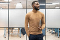 Young businessman standing in office