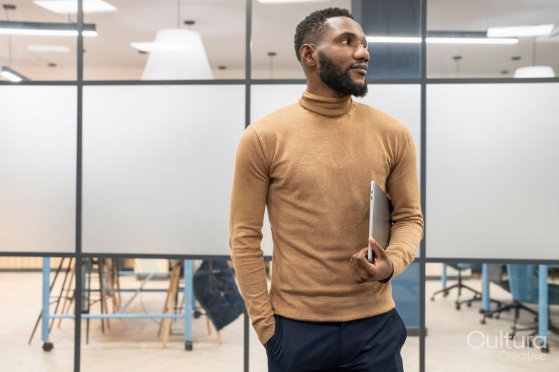 Young businessman standing in office