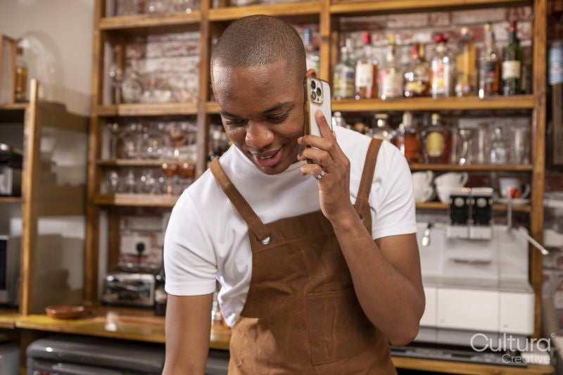 Cafe owner talking on phone