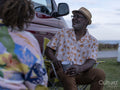 Senior couple camping in camper van