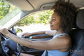 Young woman driving car