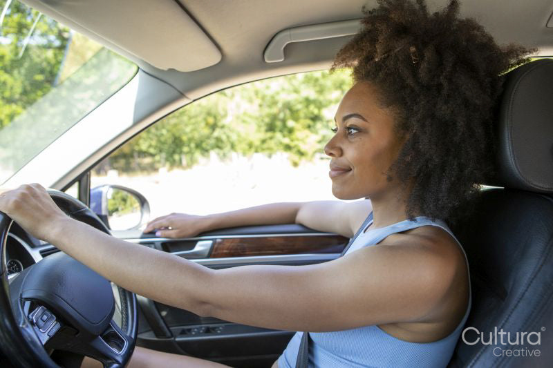 Young woman driving car