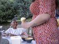 Mother preparing ice cream for children