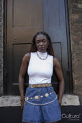 Portrait of woman wearing white top and mini skirt