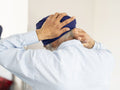 Senior man wrapping turban around head