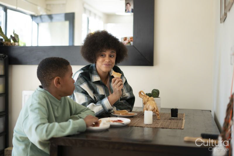 Mother and son eating at home