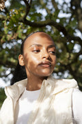 Portrait of woman in sunlight outdoors