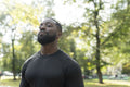 Portrait of athletic man standing in park