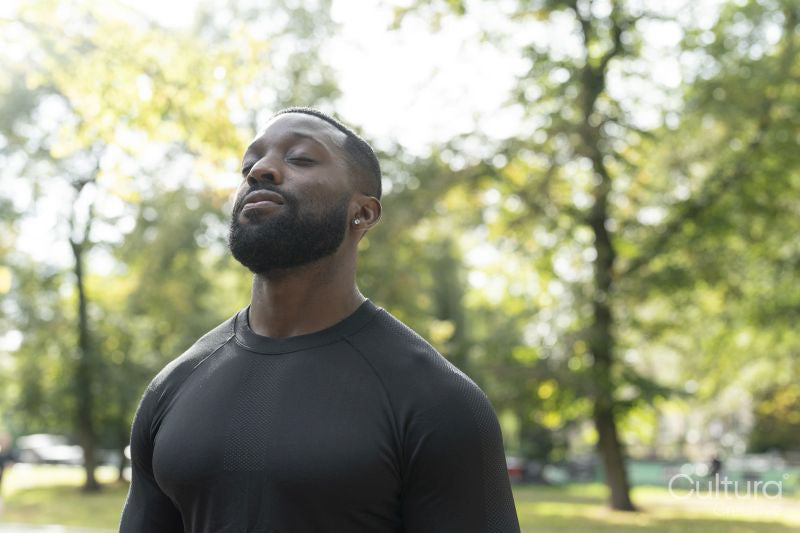 Portrait of athletic man standing in park