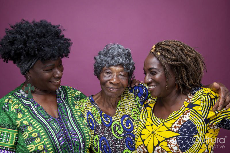 Studio shot of senior woman with mature daughters
