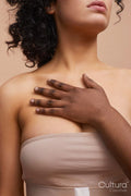 View of woman's hand resting on others woman's chest