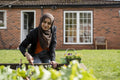 Woman wearing hijab working in garden