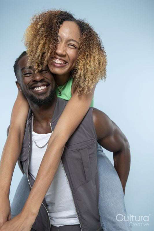 Smiling woman embracing man