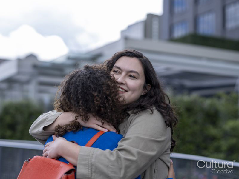 Smiling couple hugging outdoors