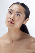 Studio portrait of shirtless woman