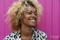 Smiling woman with curly hair
