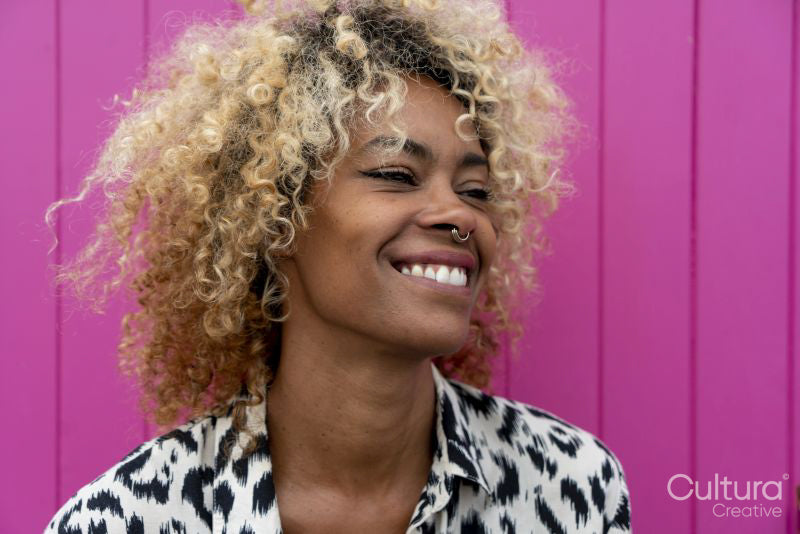 Smiling woman with curly hair