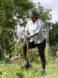 Mature woman gardening in allotment