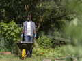 Smiling mature man gardening in allotment